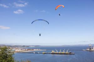 two kites flying over a large body of water at Holiday Inn Express - Concepcion by IHG in Concepción