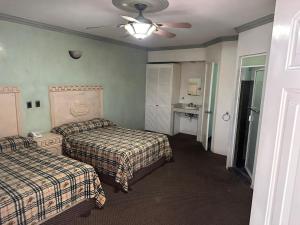 Postel nebo postele na pokoji v ubytování Hotel Real Santa Rosa