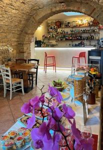 a table with plates of food on it in a restaurant at Ca' ai Tigli in Tignale