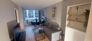 an overhead view of a living room with a couch and a table at Bergen city apartment in Bergen