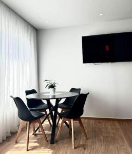 a dining room with a table and chairs at Nanas luxury and cozy apartment in Thérissos
