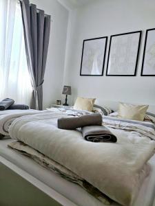a bedroom with two beds with pillows on them at Apartment Melani in Vir