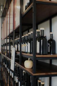 a shelf with many bottles of wine on it at Hofgut Stefan in Uhldingen-Mühlhofen