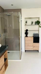 a bathroom with a shower and a sink at Ferienhaus mit Seeblick in Templin +16 photos