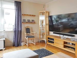 a living room with a large flat screen tv at Holiday home LYSEKIL XXXII in Lysekil