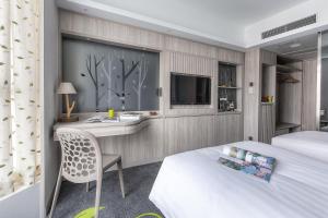 Letto o letti in una camera di Stanford Hillview Hotel Hong Kong