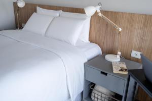 Vuode tai vuoteita majoituspaikassa ZT Coliving and Hotel