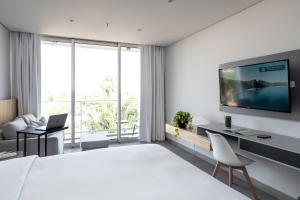 TV tai viihdekeskus majoituspaikassa ZT Coliving and Hotel