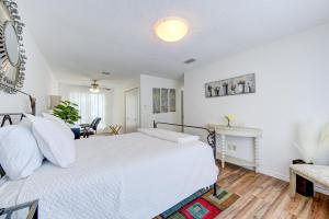 a bedroom with a white bed and a fireplace at Cozy 3 bedrooms home with indoor fireplace in Houston