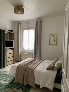 Postel nebo postele na pokoji v ubytování Charmant appartement + 10 fotografií