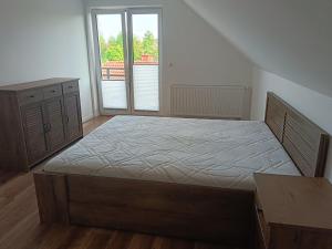 Posteľ alebo postele v izbe v ubytovaní Cichy Zakątek