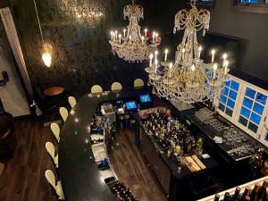 an overhead view of a bar in a restaurant with chandeliers at Inn of Chagrin in Chagrin Falls