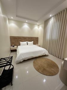 Postel nebo postele na pokoji v ubytování Zaan Apartment Al-Nafel