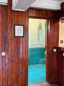 a bathroom with a shower with a glass door at Pine Peak in Predeal +122 photos