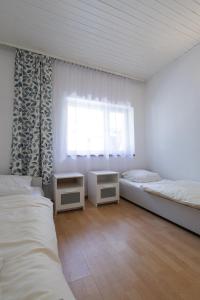 Katil atau katil-katil dalam bilik di Przystań Lubniewice