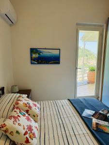 En eller flere senge i et værelse på Villa De Simone