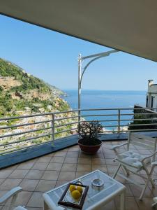 a balcony with a view of the ocean at Villa De Simone in Positano