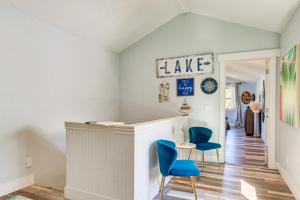a home bar with blue chairs in a hallway at Cozy Pet-Friendly Coeur dAlene Lake Cottage! in Coeur d'Alene