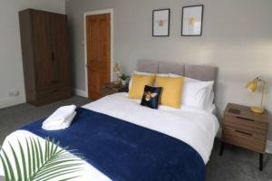 a bedroom with a bed with a dog pillow on it at 2 Bedroom Characterful House in Lancaster