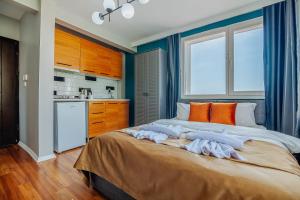 a bedroom with a large bed with orange pillows at Taksim Wonder Suites in Istanbul