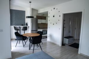 a kitchen and dining room with a table and chairs at David in Slavonski Brod