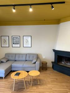 a living room with a couch and a table at Terra del Nonno in Drymon
