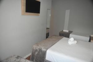 Letto o letti in una camera di Unity Hotel - Paulista - SP