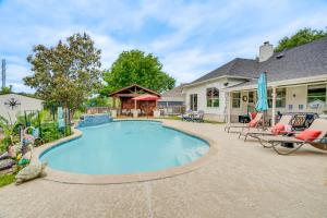 a swimming pool in the backyard of a house at Pool, Hot Tub and BBQ Family Home in Round Rock in Round Rock