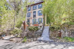 a stone house with a staircase in front of it at Lambertville Retreat - Walk to Shopping and Dining! in Lambertville
