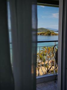a view of the water from a balcony at Sunlight apartment in Nea Peramos