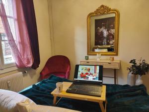 a laptop computer sitting on a table in a room at T2 54m² parking Cœur de Chartres in Chartres
