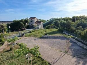 an aerial view of a garden with trees and a house at Apartment Martina in Rab +14 photos