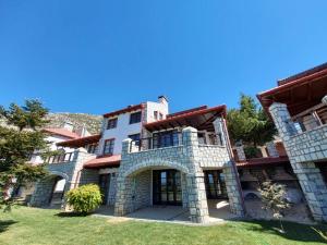 an image of a large stone building at Delphi Gorge-view Chalet, Arachova in Arachova