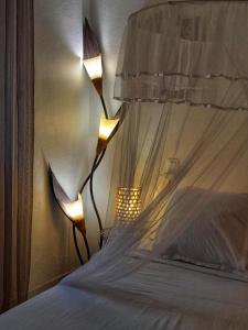 Postel nebo postele na pokoji v ubytování Appartement Papay dans Villa Fleurs des Iles + 31 fotografií