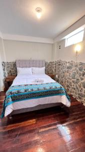 Postel nebo postele na pokoji v ubytování intikilla hostal