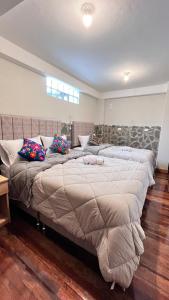 Postelja oz. postelje v sobi nastanitve intikilla hostal