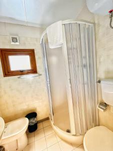 a bathroom with a shower and a toilet at CAMPING AMALASUNTA in Montefiascone