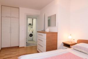 Postel nebo postele na pokoji v ubytování Apartman Karić