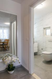 Koupelna v ubytování Apartman Karić + 11 fotografií