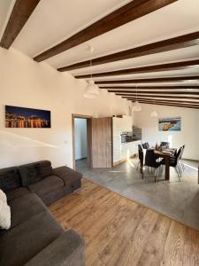 a living room with a couch and a table at Apartman Mediteran in Šibenik