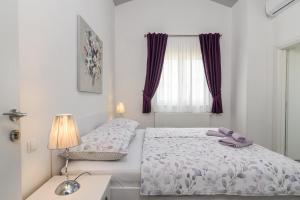 Postel nebo postele na pokoji v ubytování Rooms Anna