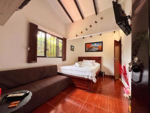 Postel nebo postele na pokoji v ubytování Paraiso Cocora + 37 fotografií