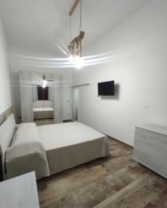 Ένα ή περισσότερα κρεβάτια σε δωμάτιο στο U Feriu home