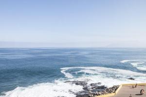 an aerial view of the ocean with waves at Holiday Inn Express - Antofagasta by IHG in Antofagasta