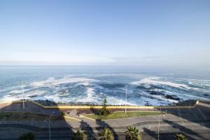 an aerial view of the ocean with waves at Holiday Inn Express - Antofagasta by IHG in Antofagasta