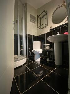 a bathroom with a toilet and a sink at Istanbul Hub Flats in Istanbul