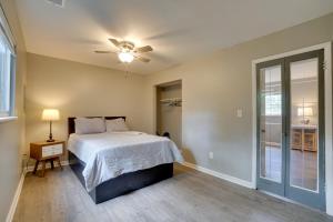 a bedroom with a bed and a ceiling fan at Dtwn Columbus Getaway Pet Friendly with Fee! in Columbus