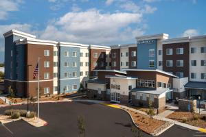 an aerial view of a hotel with a parking lot at Residence Inn by Marriott Fresno Clovis in Clovis