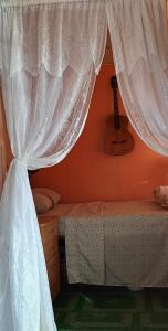 Tempat tidur dalam kamar di Kapeta Cabin