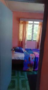 Cama ou camas em um quarto em Kapeta Cabin